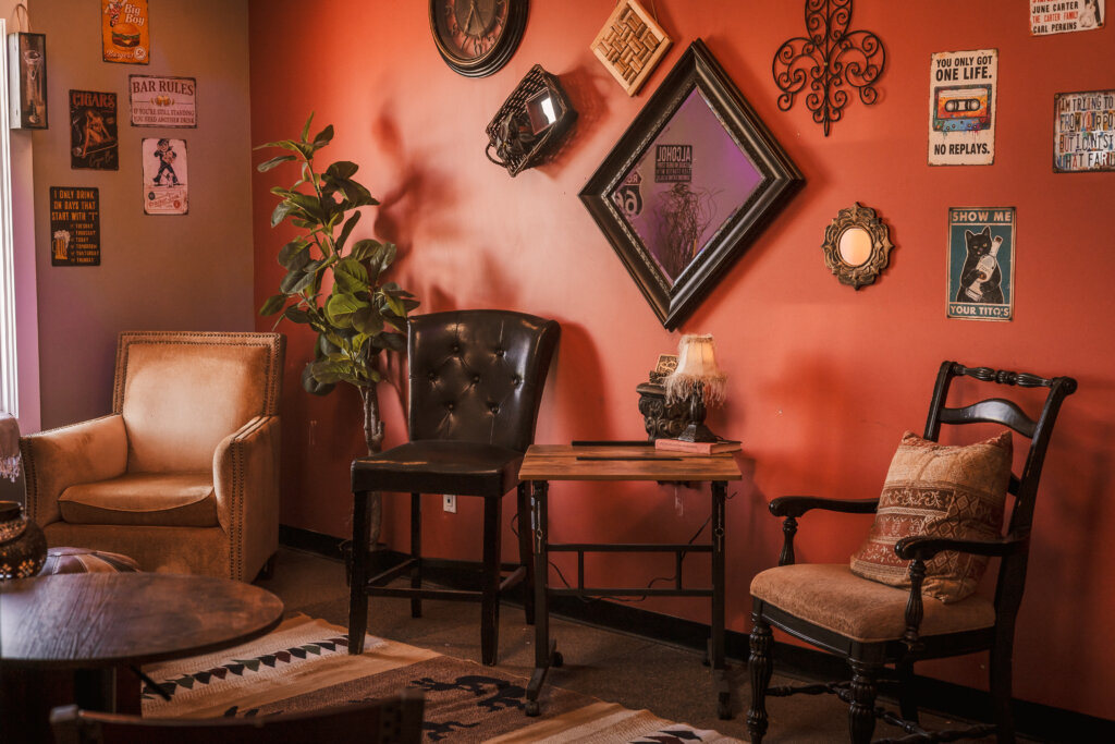 Photo showing some of The Intern Lounge that has vintage vibes and seating located inside 726 Studios in Downtown Phoenix.
