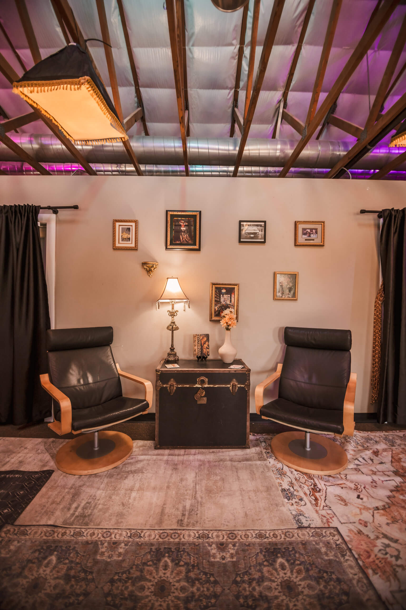 Sitting area at the upstairs Intern Lounge showing cool lighting in the rafters of the historic creative venue space in Downtown Phoenix.