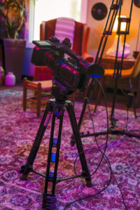 726-Studios-Phoenix-Studio-and-Equipment-Rental-22 Photo of video camera on stand with cables running down during set up of video production in Phoenix